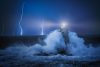 Vlies Fotótapéta - Lighthouse in storm - 375x250 cm